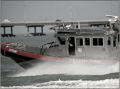 U.S. Coast Guardsman Firing Non-Lethal Munitions Aboard a Cutter